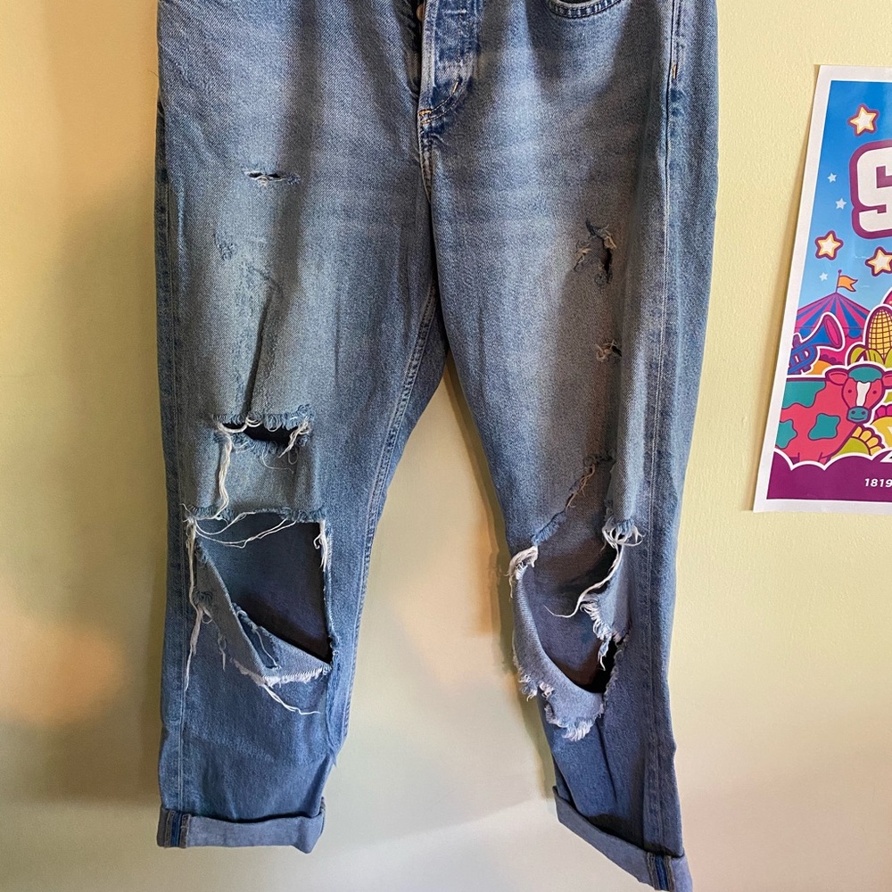Distressed button fly boyfriend jeans